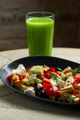 Greek salad with feta cheese, tomatoes, cucumbers, onions and croutons