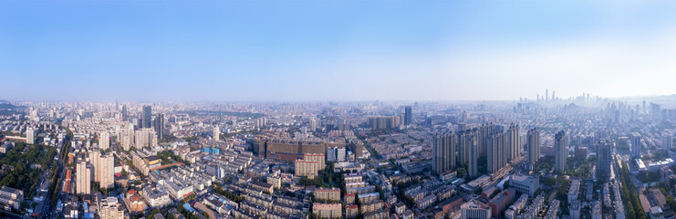 Expansive Urban Cityscape with Clear Blue Skies and Skyscrapers