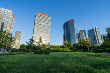 Modern Urban Landscape with Green Space and Skyscrapers