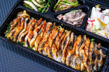 a bowl of rice topped with eel. korea food