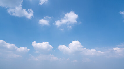 A Tranquil Sky Filled with Soft White Clouds and Clear Blue Atmosphere