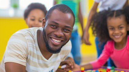 Smiling father and children playing together in a colorful room.