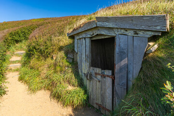 Hawker's Hut, an old, wooden hut on the cliffside on South West Coast Path nearby Morwenstow,...