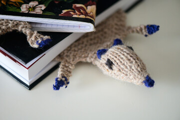 Fototapeta premium Close up of knitting toy bookmark in book