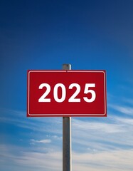 Obraz premium Text 2025 on red sign against blue sky 