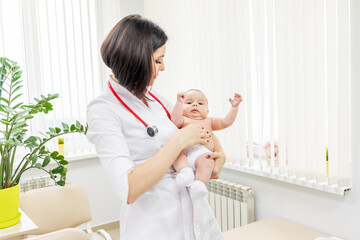 baby is examined by a pediatrician at the clinic, massage for the child