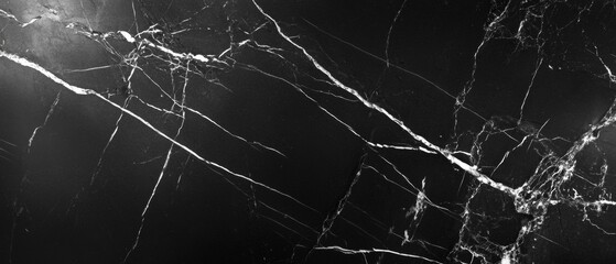 A black and white photo of a stone wall with cracks and holes