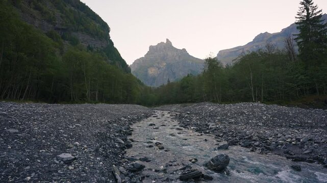 Landscape of Cirque du Fer a Cheval with river flowing in the valley at Sixt Fer a Cheval, France