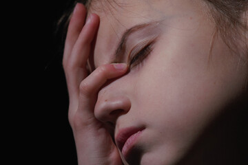 Pain in children. Very sad young girl. Loneliness, pain, child tragedy.  Horizontal image.