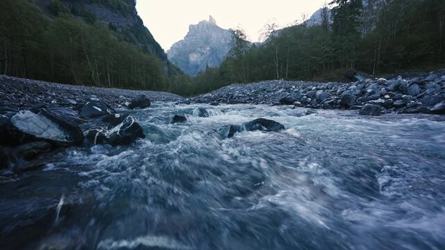 Landscape of Cirque du Fer a Cheval with river flowing in the valley at Sixt Fer a Cheval, France