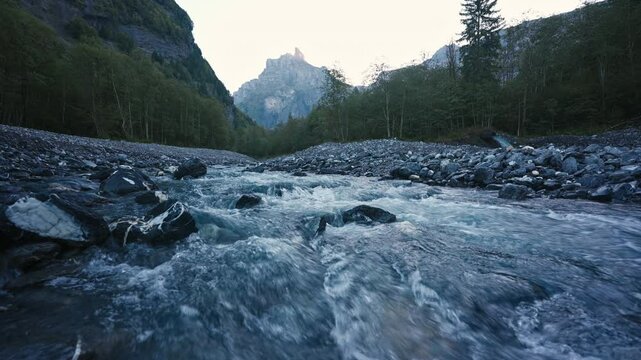 Landscape of Cirque du Fer a Cheval with river flowing in the valley at Sixt Fer a Cheval, France
