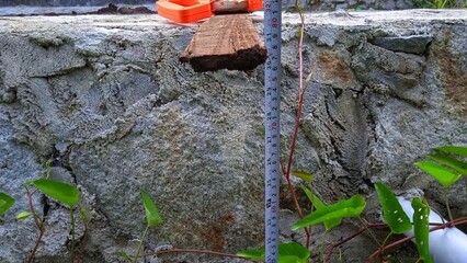 Measuring the depth of a trench dug for a culvert