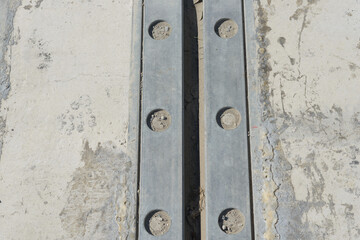 bridge plate anchors or brackets on the ground