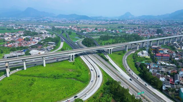 Established Aerial View of Pasir Koja Interchange, the meeting point of Soroja Toll Road, Purbaleunyi Toll Road and Jakarta-Bandung High Speed ​​Rail Line, Bandung, Indonesia
