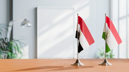 FLAGS OF EGYPT AND TAJIKISTAN ON TABLE