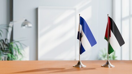 FLAGS OF EL SALVADOR AND JORDAN ON TABLE