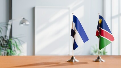 FLAGS OF EL SALVADOR AND NAMIBIA ON TABLE