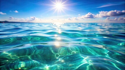 Obraz premium Crystal clear turquoise water reflecting the bright sunlight, creating a mesmerizing display of shimmering waves and soft, ethereal clouds in the sky.