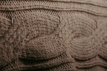 Cable knit oatmeal colored blanket close up