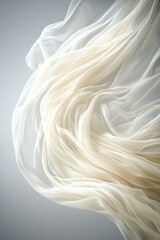 Fototapeta premium Elegant Brides Veil in Soft Focus Against Gray Background with Blank Space for Text