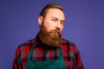Fototapeta premium Photo of handsome man gardener wear red plaid shirt look camera suspicious news isolated on purple color background