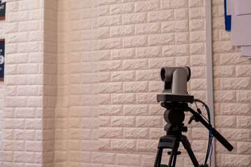 PTZ camera is taking pictures of content creators doing professional live streaming in a studio...