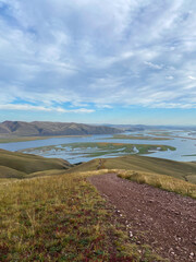 The autumn landscape with mountains and the river