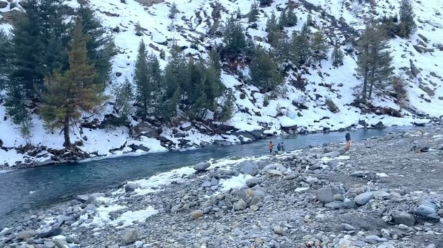 MANALI, INDIA - January 9, 2024: Beautiful journey between the snow mountains of Rohtang Pass in Himalayas.Snow mountains landscape.Winter ride between snow mountains.Beautiful snow mountains.