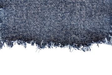 Piece of torn denim on a white background. Denim texture