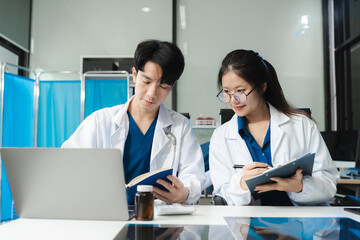 Doctor team, analysis the blood test examination results and medication usage of the patient on the chart, medical check-up concept.