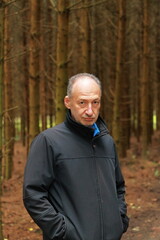 portrait of a man against the background of a forest, man in the forest, portrait, man, adult, age,...