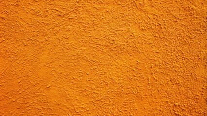 Naklejka premium A Detailed Textured Orange Wall Surface with a Rough and Uneven Finish