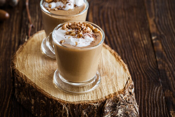 Autumn dessert pumpkin pudding  with whipped cream