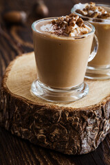 Autumn dessert pumpkin pudding  with whipped cream