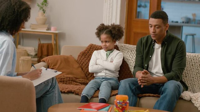 African American offended child daughter little girl problem difficult relationships family misunderstanding quarrel conflict father parent man session psychologist specialist therapy negative preteen