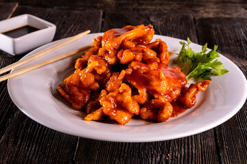 Sweet and Sour Chicken on wood table. Chinese food.