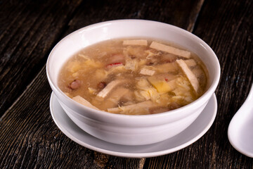 Chinese Tofu Vegetable Soup on wood table. Chinese food. Food concept.