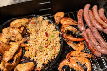 The perfect summer meal grilled chicken shrimp sausages and fried rice