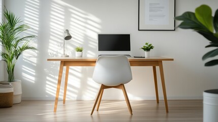Minimalist home office with desk, computer, plants, and natural light.