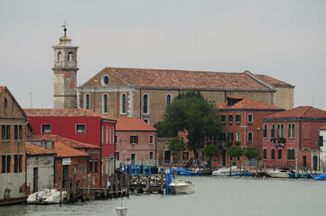 Venice, Veneto, Italy. October 24, 2010: Historic buildings along a Venice canal on a cloudy day.