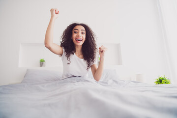 Photo of young sweet adorable lady sit bed winning dressed sleepwear chill apartment waking up...