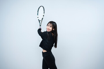 テニスをする女性