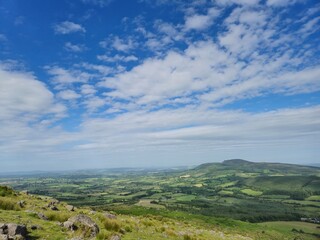Fototapeta premium Irish Summer Landscape: Verdant Hills And Majestic Mountains