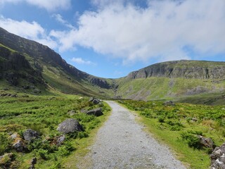 Verdant Summer Hills And Rocky Mountains: A Scenic Countryside Of Ireland