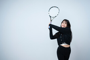テニスをする女性