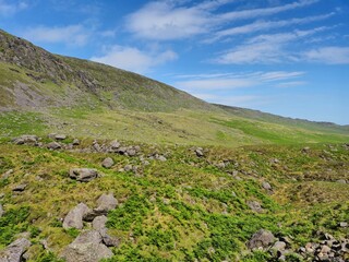 Scenic Summer Landscape Of Green Hills And Rocky Mountains In Ireland