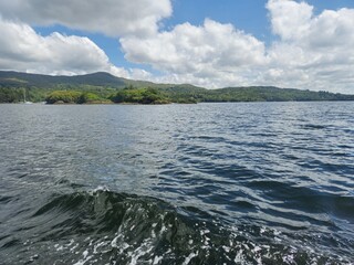 Tranquil Waterscape: Serene Reflections Of Clouds Over A Scenic River