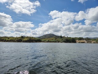 Tranquil River Landscape With Cloud Reflections And Gentle Waves