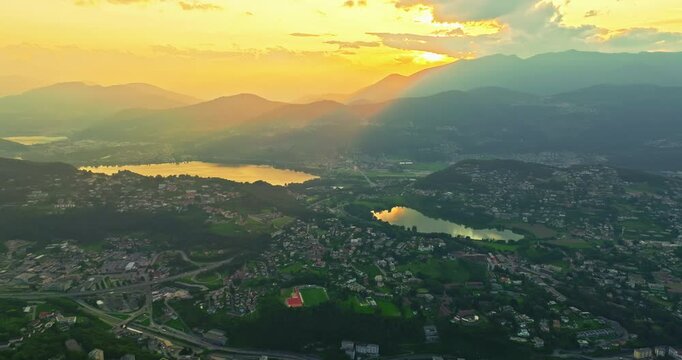 Aerial view of Lugano city and lugano lake from San Salvatore mountain. Aerial footage of the Monte Bre overlooking the city of Lugano in Canton Ticino in Switzerland