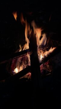 a burning bonfire in the dark of night